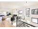 Bright living room features a piano, fireplace, and large windows at 6435 E 6Th Avenue Pkwy, Denver, CO 80220