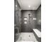 Spa-like shower with gray geometric tile and built-in shelving at 6435 E 6Th Avenue Pkwy, Denver, CO 80220