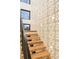 Light-filled staircase featuring a unique geometric wall design at 6435 E 6Th Avenue Pkwy, Denver, CO 80220