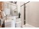 Charming bathroom with a modern sink, tiled walls, and rustic brick accents for a unique touch at 1810 E 33Rd Ave, Denver, CO 80205
