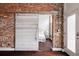 Unique sliding barn door leading to a bedroom, highlighting the home's character at 1810 E 33Rd Ave, Denver, CO 80205