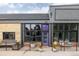 Charming building exterior with a purple door, decorative planters, and brick accents at 1810 E 33Rd Ave, Denver, CO 80205