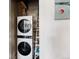 Convenient laundry area with stacked washer and dryer, maximizing space and functionality at 1810 E 33Rd Ave, Denver, CO 80205