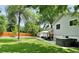 This backyard features a lawn, an outdoor seating area with a hot tub, and a shed at 5389 W Roxbury Pl, Littleton, CO 80128