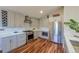 A modern kitchen featuring stainless steel appliances and ample cabinet space for storage at 5389 W Roxbury Pl, Littleton, CO 80128