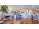 Bright, modern kitchen with an island, stainless steel appliances and hardwood floors at 5389 W Roxbury Pl, Littleton, CO 80128
