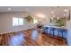 Spacious kitchen with hardwood floors, stainless appliances, and bright lighting at 5389 W Roxbury Pl, Littleton, CO 80128