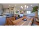 Updated kitchen featuring stainless steel appliances, an island and a dining area at 5389 W Roxbury Pl, Littleton, CO 80128
