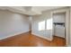 The laundry room includes a white washer and dryer, upper cabinets and vinyl floors at 5389 W Roxbury Pl, Littleton, CO 80128