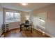 Bright office space with hardwood floors, a large window, and ample natural light, ideal for a productive workspace at 5389 W Roxbury Pl, Littleton, CO 80128