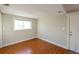 Bright room with vinyl floors, window and a door to the outside at 5389 W Roxbury Pl, Littleton, CO 80128