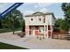 Two-story red home with balcony, under construction, in a new development at 13546 E 103Rd Pl, Commerce City, CO 80022