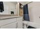 Bathroom features a shower/tub combo, vanity, and tile flooring at 6484 S Harvest St, Aurora, CO 80016