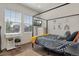 Cozy bedroom featuring a four-poster bed and wood floors at 6484 S Harvest St, Aurora, CO 80016