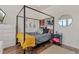 Bedroom with a full-size bed, dresser, and modern decor at 6484 S Harvest St, Aurora, CO 80016