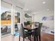 Bright dining area with patio access and seating for four at 6484 S Harvest St, Aurora, CO 80016