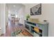 Bright and spacious entryway with wood floors and a stylish console table at 6484 S Harvest St, Aurora, CO 80016