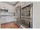 Stainless steel appliances and double oven in a modern kitchen at 6484 S Harvest St, Aurora, CO 80016