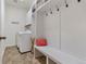 Convenient laundry room with washer, dryer, and built-in storage at 6484 S Harvest St, Aurora, CO 80016