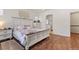 Main bedroom with attached bath and hardwood floors at 6484 S Harvest St, Aurora, CO 80016