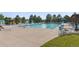 Community pool with lounge chairs and umbrellas at 6484 S Harvest St, Aurora, CO 80016