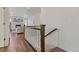 Modern staircase with a clean, white railing and dark wood accents at 6484 S Harvest St, Aurora, CO 80016