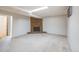 Spacious carpeted basement with a stone fireplace and a skylight, perfect for a cozy living space at 12218 Monroe Dr, Thornton, CO 80241