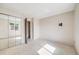 Bedroom with mirrored closet doors, neutral carpet, and television mount at 12218 Monroe Dr, Thornton, CO 80241