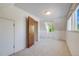 Bedroom featuring multiple windows, providing ample natural light and a neutral color palette at 12218 Monroe Dr, Thornton, CO 80241