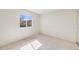 Bright bedroom featuring a window providing natural light and a neutral color palette at 12218 Monroe Dr, Thornton, CO 80241