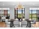 Dining area featuring modern light fixture, seating for six, and expansive windows with scenic views at 1590 Little Raven St # 408, Denver, CO 80202