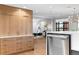 Kitchen boasting natural wood cabinets, stainless steel appliances, and hardwood flooring at 1590 Little Raven St # 408, Denver, CO 80202