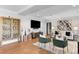 Well-lit living room featuring hardwood floors, modern furniture, and stylish decor at 1590 Little Raven St # 408, Denver, CO 80202