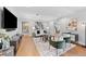 Spacious living room boasts hardwood floors, neutral decor, and ample natural light at 1590 Little Raven St # 408, Denver, CO 80202