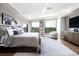 Serene main bedroom with large windows, neutral tones, and a spacious layout at 1590 Little Raven St # 408, Denver, CO 80202