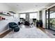 Bright office space with large windows, modern decor, and sliding glass doors to a balcony at 1590 Little Raven St # 408, Denver, CO 80202