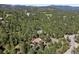 Secluded mountain property surrounded by lush forest and mature trees offering privacy and natural beauty at 2976 Hiwan Dr, Evergreen, CO 80439