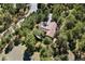 Mountain property featuring a secluded home with a well-maintained roof and beautiful surrounding trees at 2976 Hiwan Dr, Evergreen, CO 80439