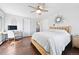 Bedroom featuring wood floors, desk, and adjacent bathroom at 2976 Hiwan Dr, Evergreen, CO 80439