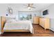 Sunny bedroom featuring large windows with views at 2976 Hiwan Dr, Evergreen, CO 80439
