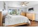 Bright bedroom with large windows and hardwood floors at 2976 Hiwan Dr, Evergreen, CO 80439