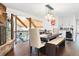 Stunning dining room with stone fireplace, wood floors, and an elegant light fixture at 2976 Hiwan Dr, Evergreen, CO 80439