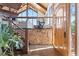 Welcoming entryway featuring stone accents, a staircase, and a glimpse into the living area at 2976 Hiwan Dr, Evergreen, CO 80439