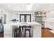 Open-concept kitchen features a spacious island with seating and modern finishes at 2976 Hiwan Dr, Evergreen, CO 80439