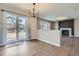 Open dining area featuring wood floors, sliding glass doors, and a decorative chandelier at 1169 N Tabor Dr, Castle Rock, CO 80104