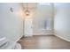 Bright entryway with high ceilings, modern light fixture, and wood-look flooring at 1169 N Tabor Dr, Castle Rock, CO 80104