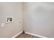 Neutral laundry room with connections for a washer and dryer and wood-look flooring at 1169 N Tabor Dr, Castle Rock, CO 80104
