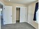Bright bedroom with double closets and neutral carpeting at 7982 Larkspur Cir, Frederick, CO 80530