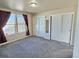 Bright bedroom with double closets and window view at 7982 Larkspur Cir, Frederick, CO 80530