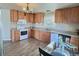 Bright kitchen features wood cabinets, and a dining area at 7982 Larkspur Cir, Frederick, CO 80530